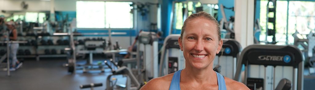 girl smiling at workout gym