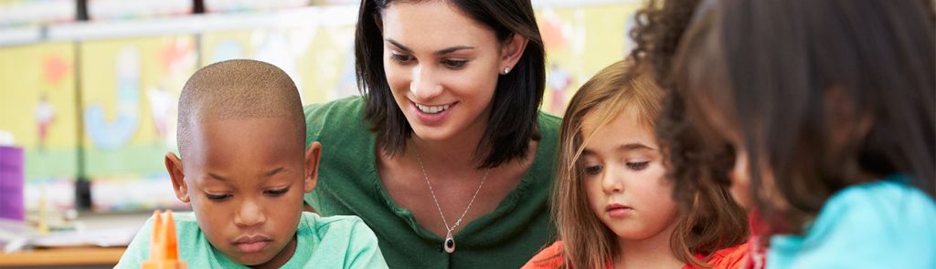 children reading with teacher