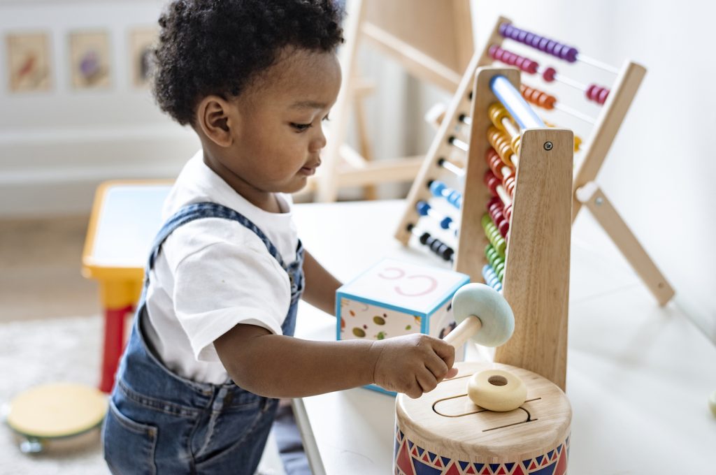 Toddler playing with toys.