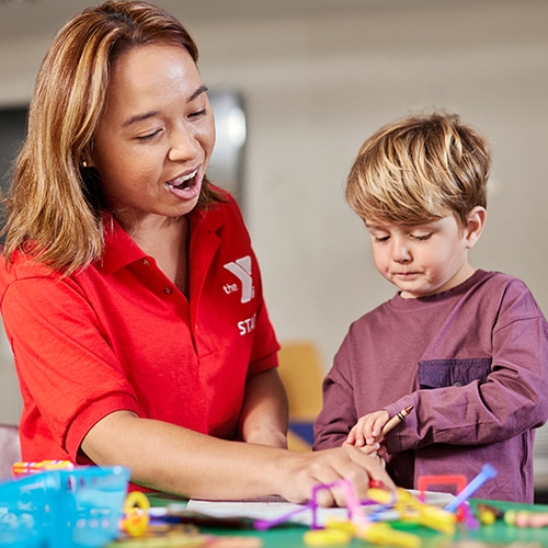 preschool child with teacher