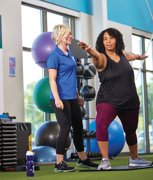 personal training working with woman at the Y
