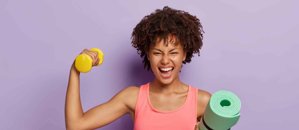 woman holding barbells