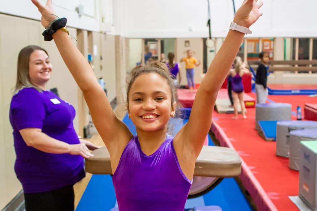 girl completing gymnastics skill