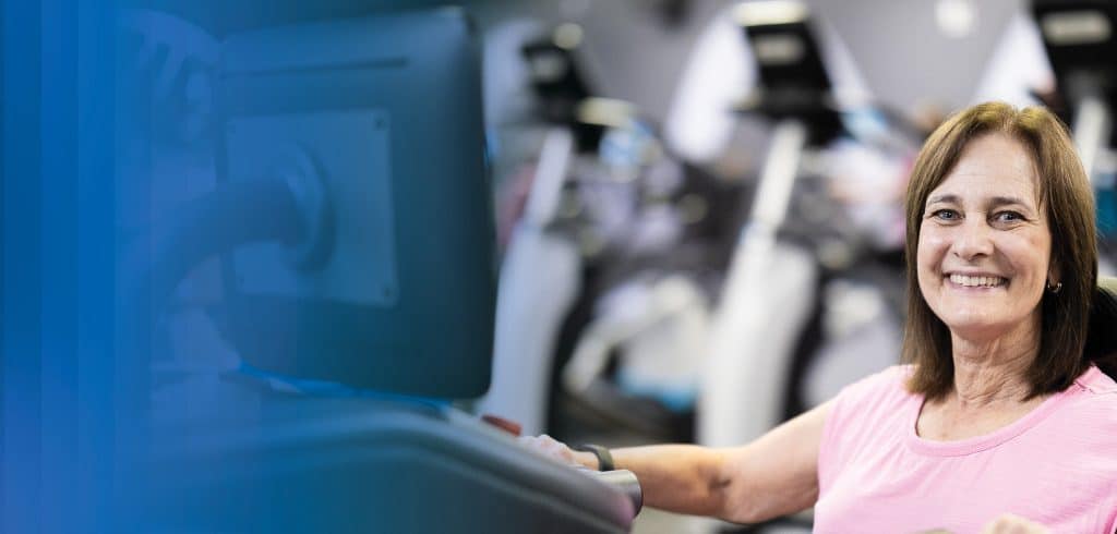 woman exercising at the Y hero image