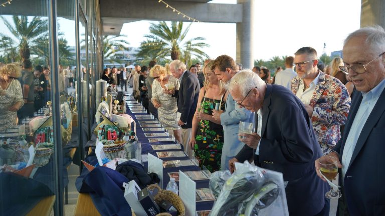 guests at the gala bidding at silent auction