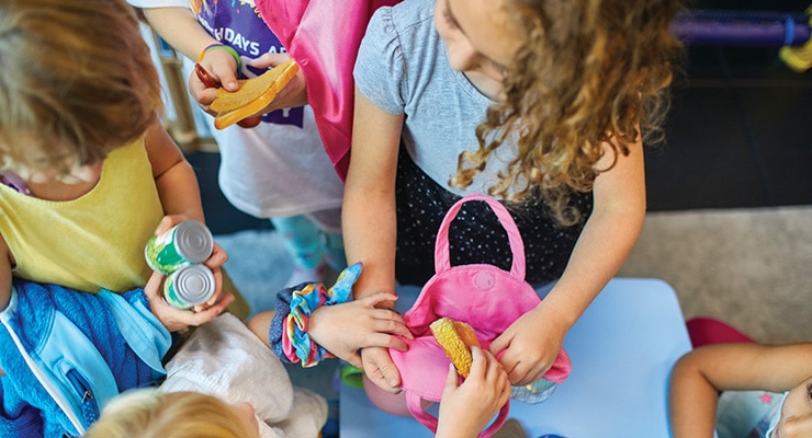kids doing crafts at a party