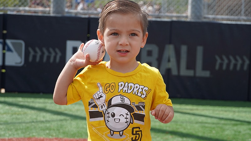 rookie league boy throwing ball