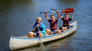 boys in canoe at overnight camp